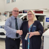 Zoe receiving her 25 year award from Steve Baker